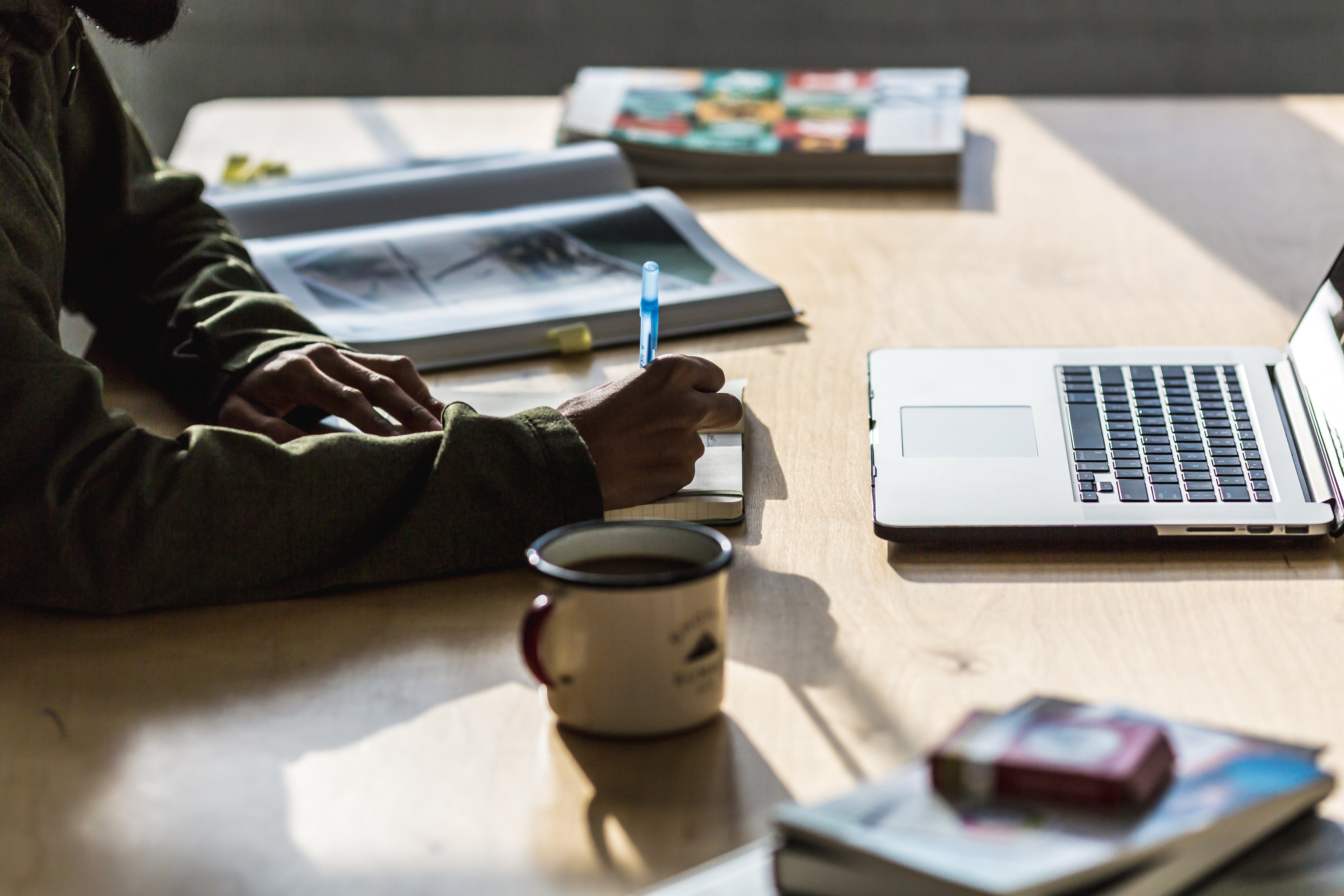 man-writing-at-desk.jpg
